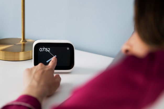 close up hand setting alarm