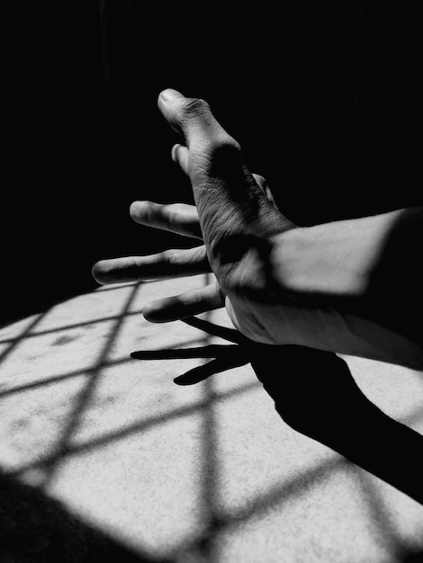 Close-up of hand on table