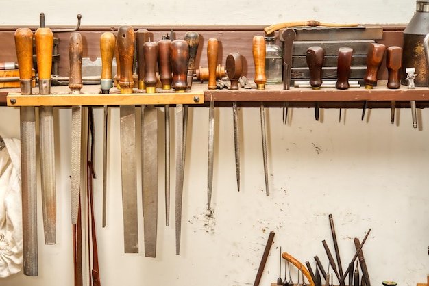 Photo close-up of hand tools at workshop