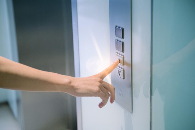 Close-up of hand touching open door