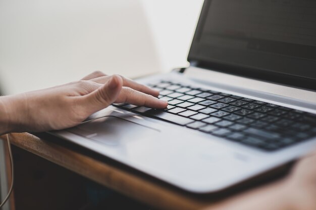 Close up hand typing on computer key board