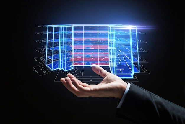 close up of hand with virtual construction project