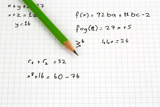 Photo close-up of hand written mathematical formulas. concept of education