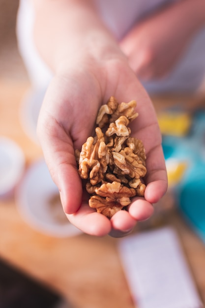 close up of handful of walnuts