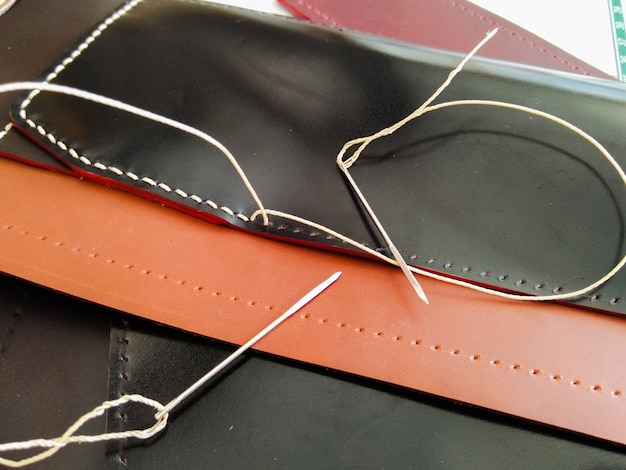 Close up handmade leatherwork sewing 