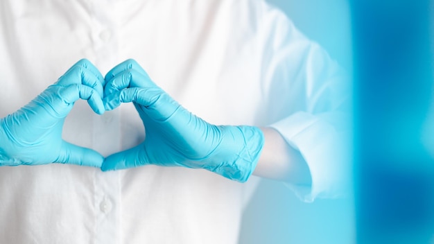 Close-up of hands against white blue background