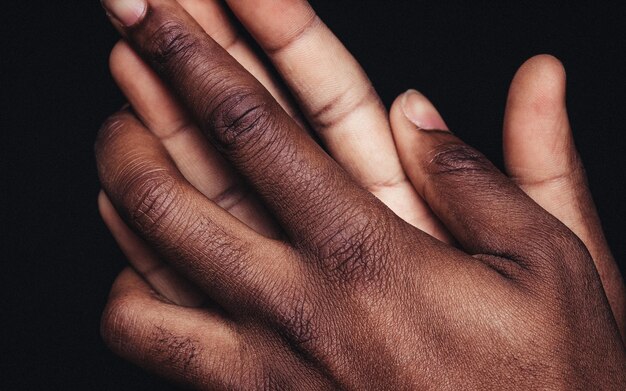 Close-up of hands over black background