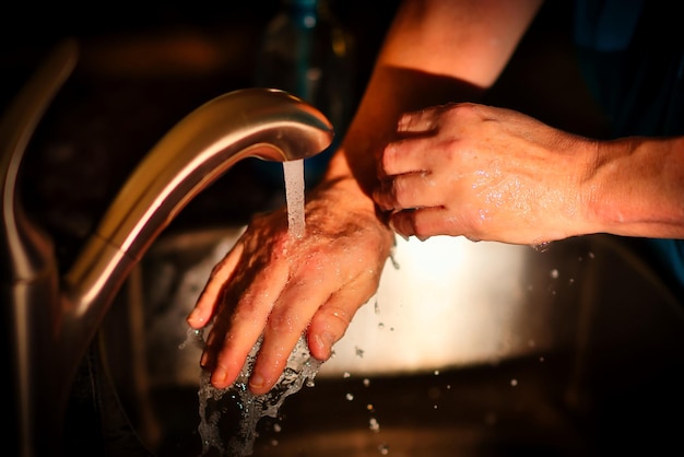 close-up of hands cleaning hands