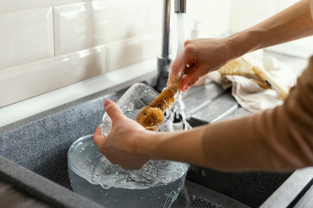 Close up hands cleaning mug