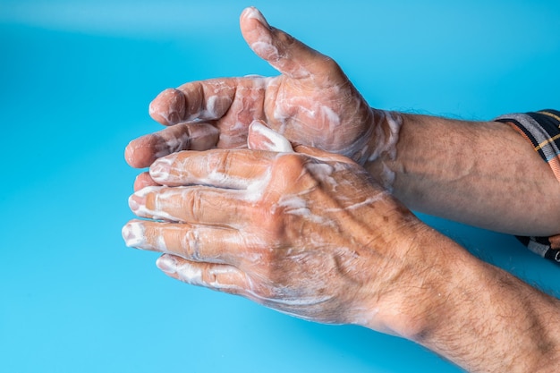 Close up of hands covered with soap