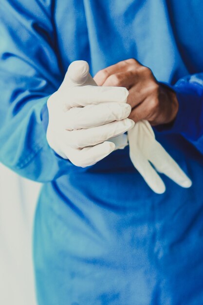 Close-up of hands holding blue finger