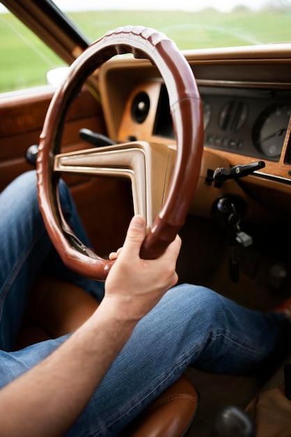 Close up hands holding car wheel