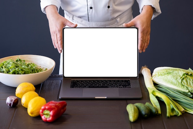 Close-up hands holding laptop