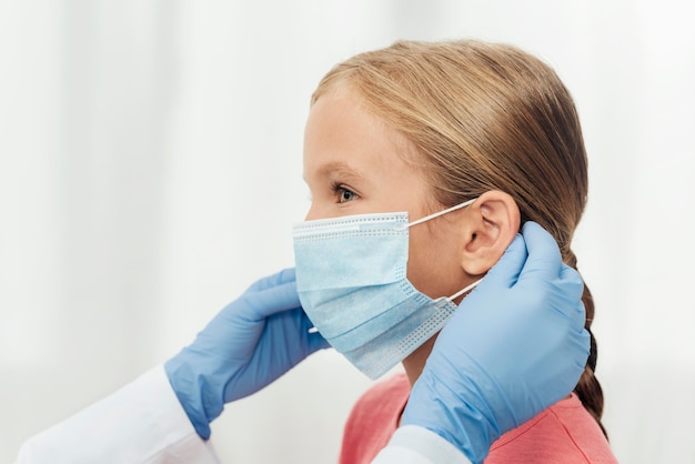 Close-up hands holding medical mask