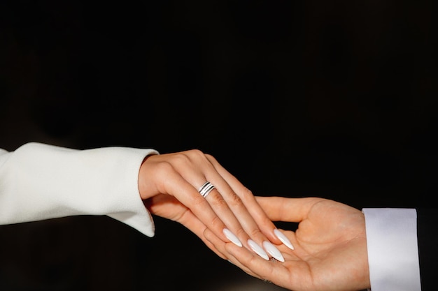 close up of a hands holding a ring