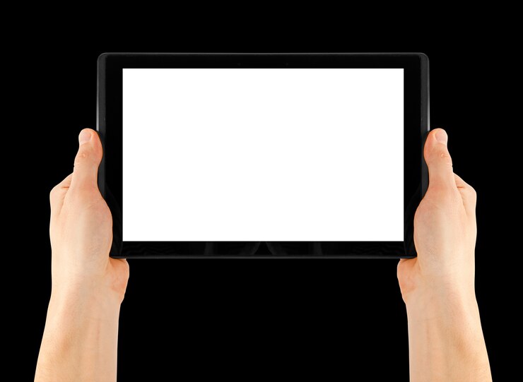 Photo close up on hands holding a tablet