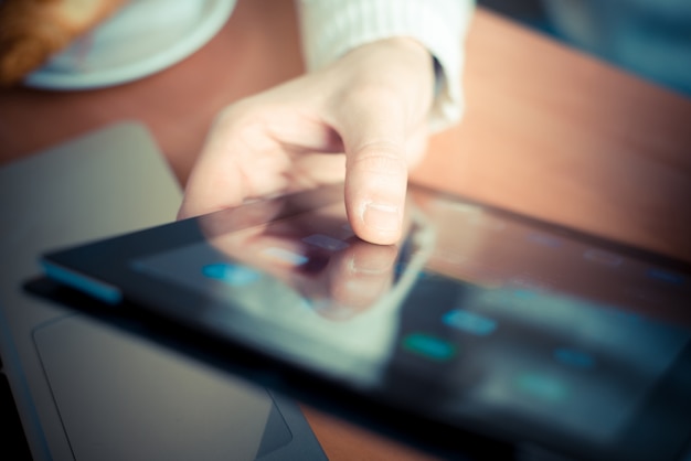 Photo close up hands multitasking man using tablet, laptop and cellhpone