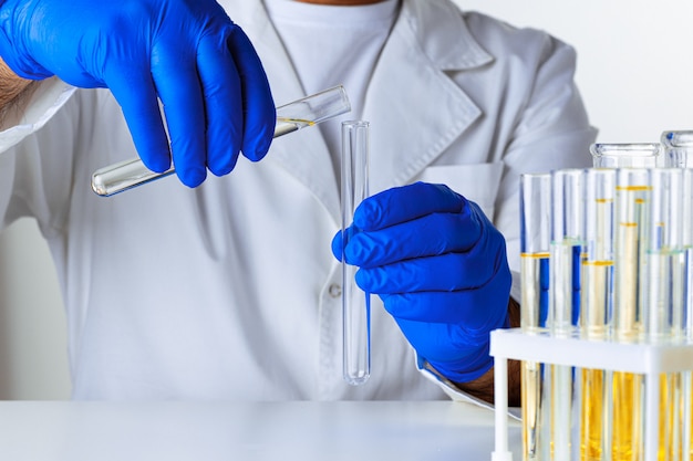 Close up of hands of a scientist working with laboratory samples