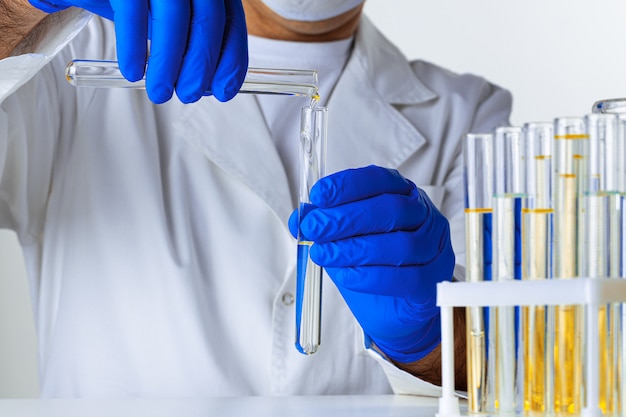 Close up of hands of a scientist working with laboratory samples