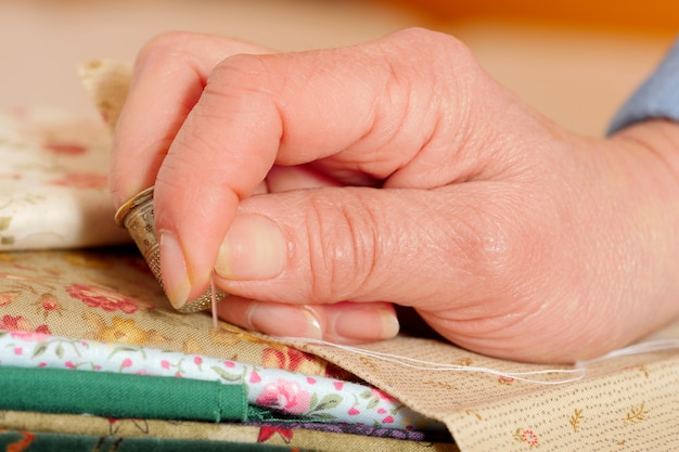 Close-up of the hands of a seamstress