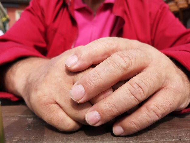 Close-up of hands on table