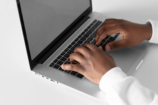 Close up hands typing on keyboard