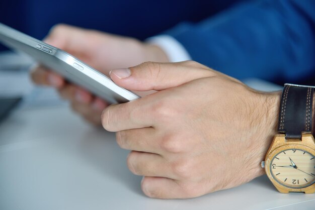 Close up of hands using tablet computer