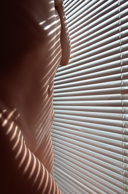 Close-up of hands on window