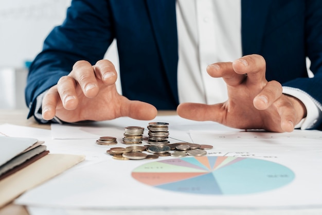 Close-up hands with coins