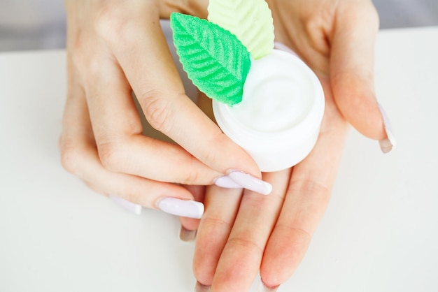 Close Up of Hands With Cream or Therapeutic Salve