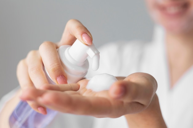 Close up hands with face product