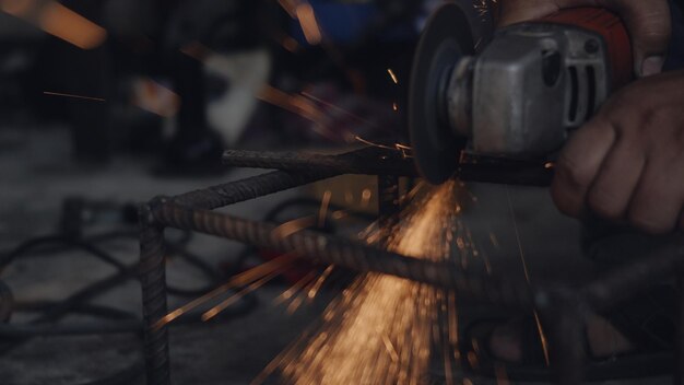 Close-up of hands working in factory