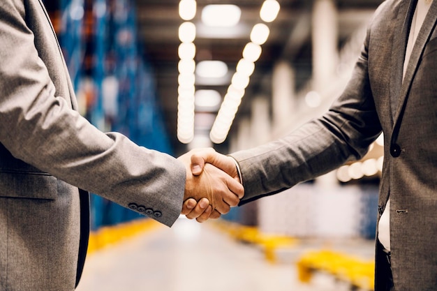 Close up of a handshake of business partners at storage