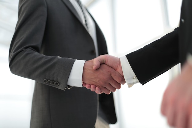 Close up handshake business partners