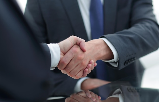 Close up handshake business people concept of partnership