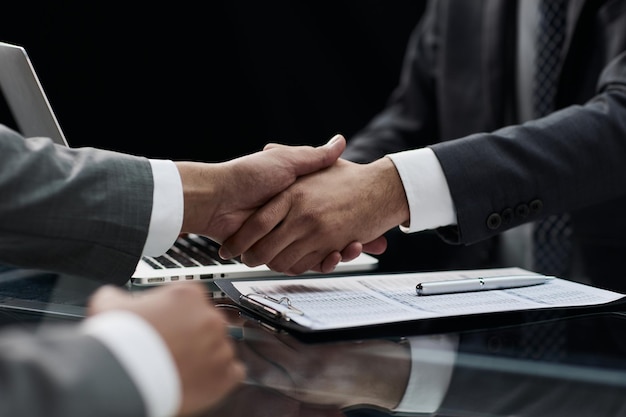 Close up handshake of business people in the office