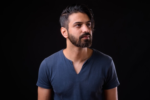 Close up of handsome bearded Persian man isolated