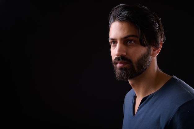 Close up of handsome bearded Persian man isolated