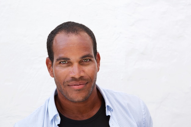 Close up handsome casual man standing by white background