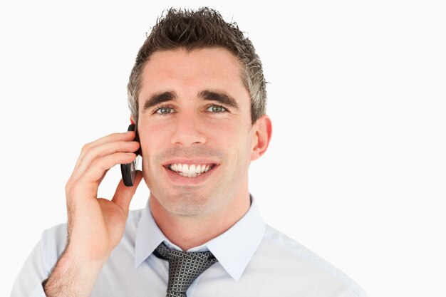 Close up of a happy businessman making a phone call