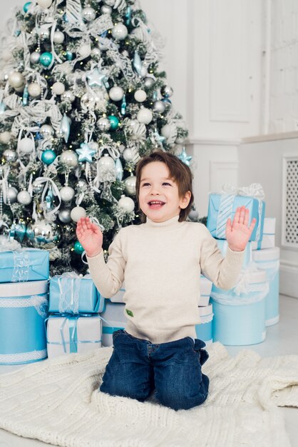 Close up on happy child boy with gift box