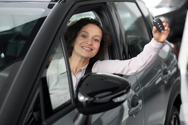 Photo close up on happy customer in car dealership