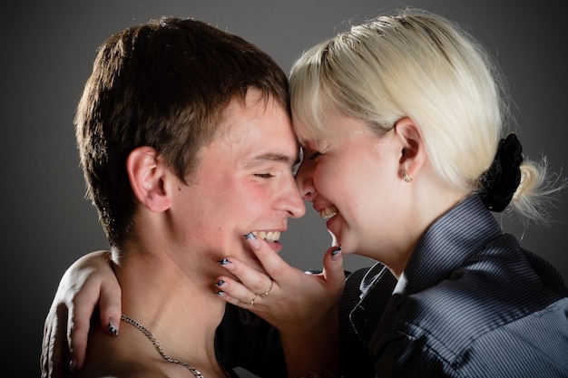 Close up of happy middleaged man and woman kissing with fondness Their eyes are closed
