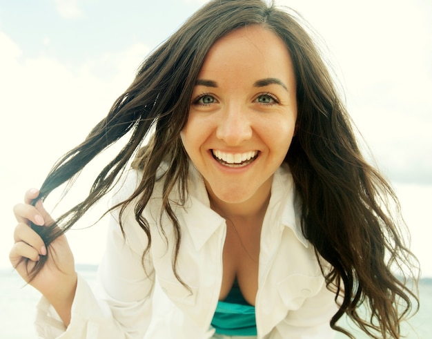 Close up Happy woman near ocean, summer vacation