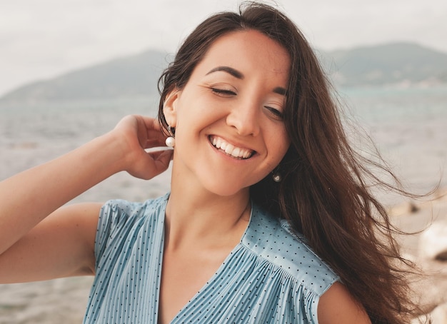 Close up Happy woman near ocean summer vacation