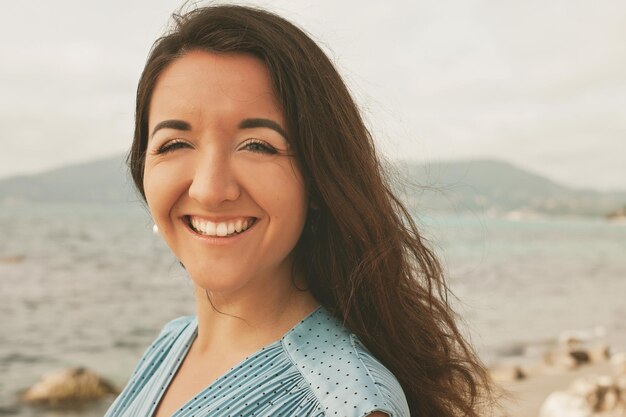 Close up Happy woman near ocean summer vacation