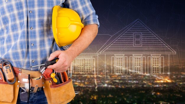 Close-up of hard hat holding by construction worker