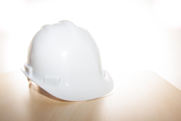 Close-up of hardhat on table against white background