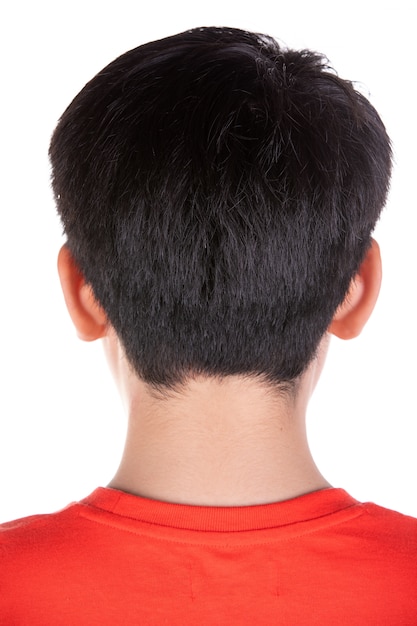 写真 アジアの少年の黒い髪の裏側の頭を閉じます。