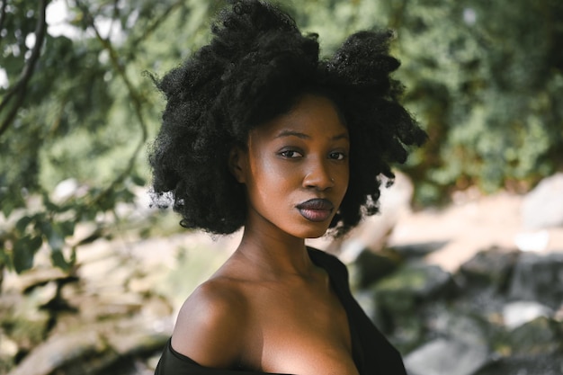 Close up headshot fashion portrait beautiful young african american black woman naked shoulders